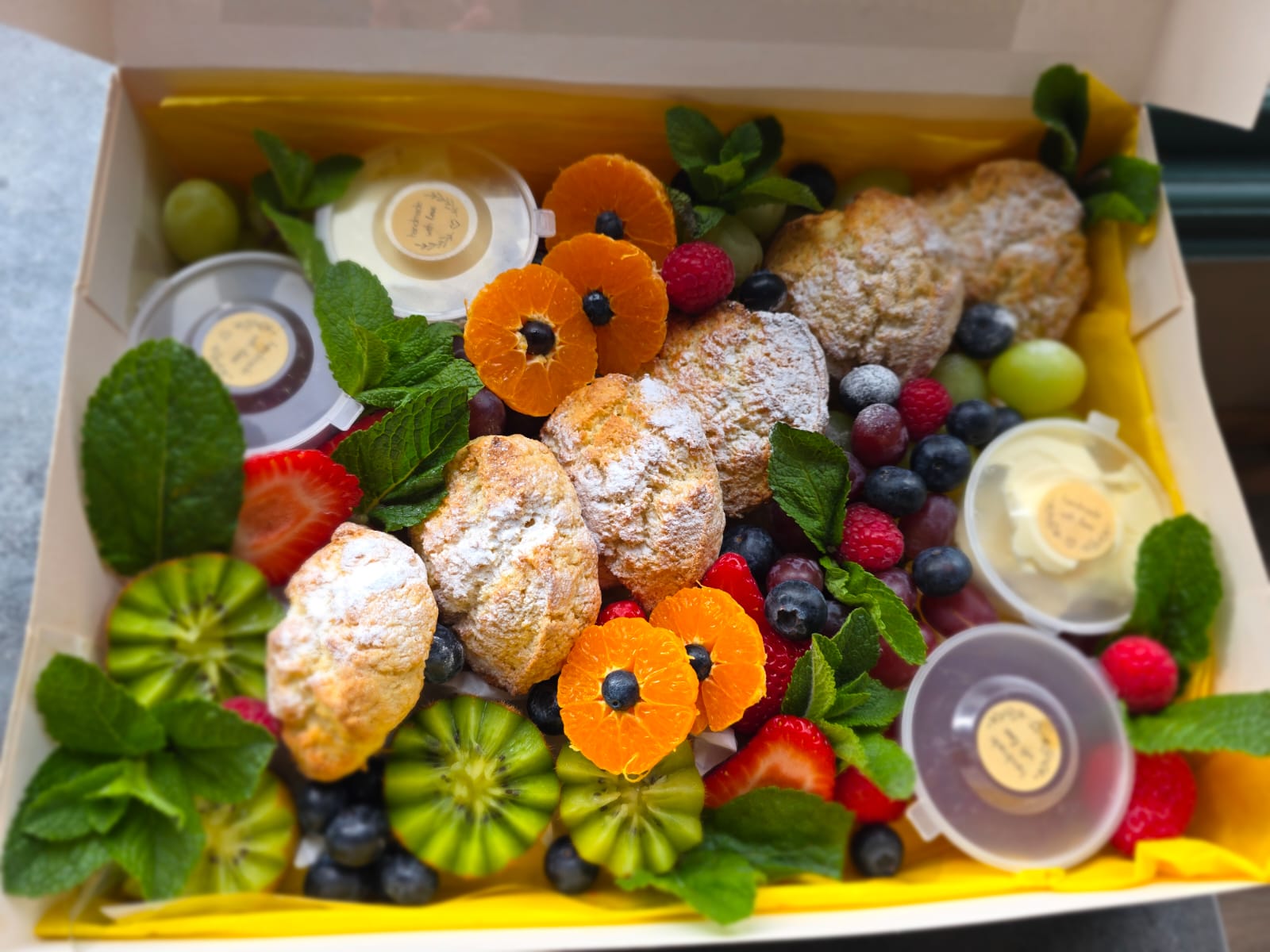 Scone board with fresh flowers and berries