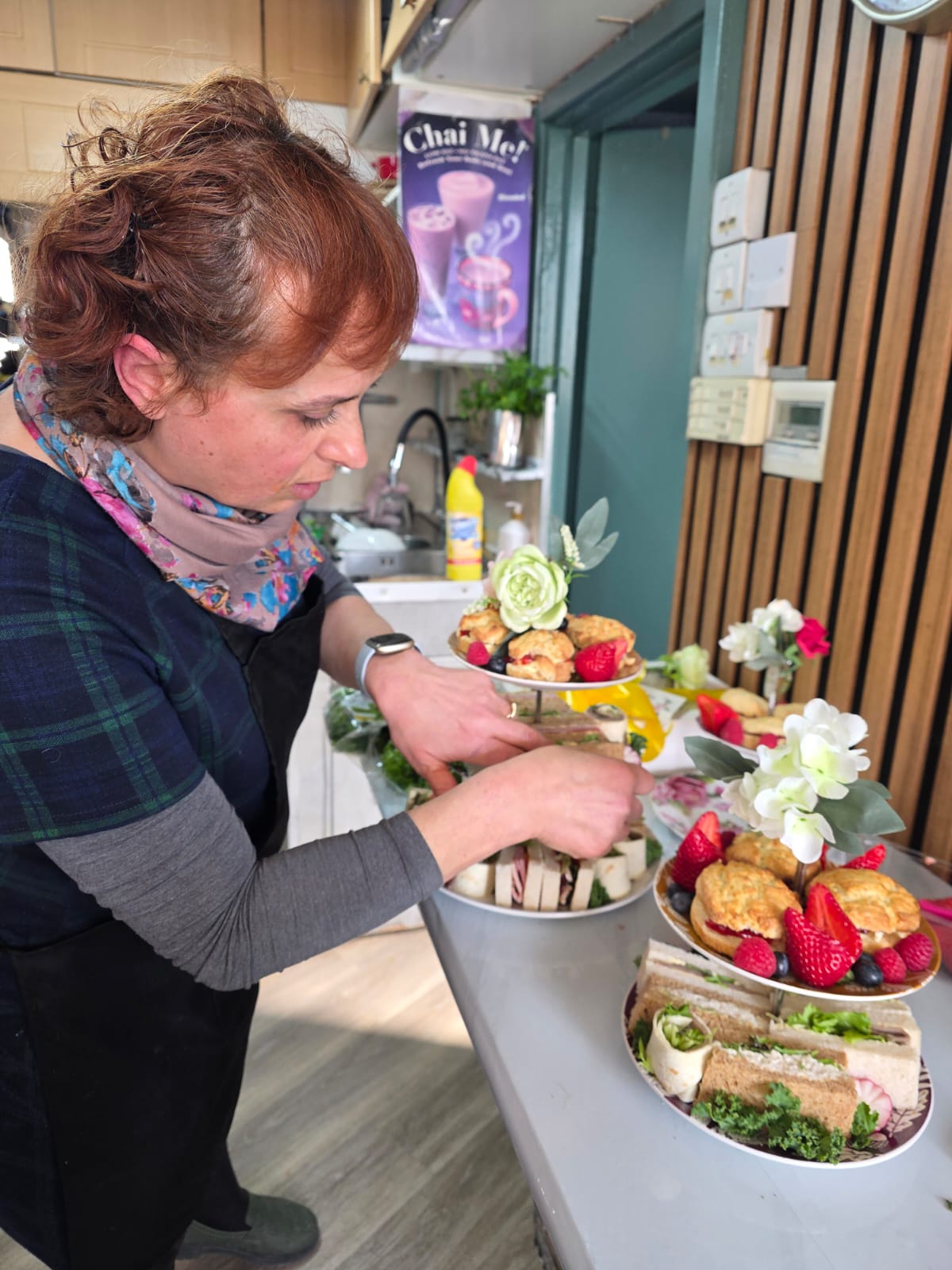 Semra arranging a tiered Easter display