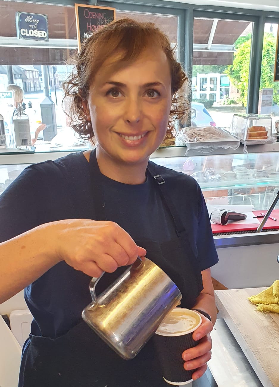 Semra pouring a coffee at Crumbs Too